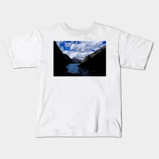 Kayaking in the mountains shadows Kids T-Shirt